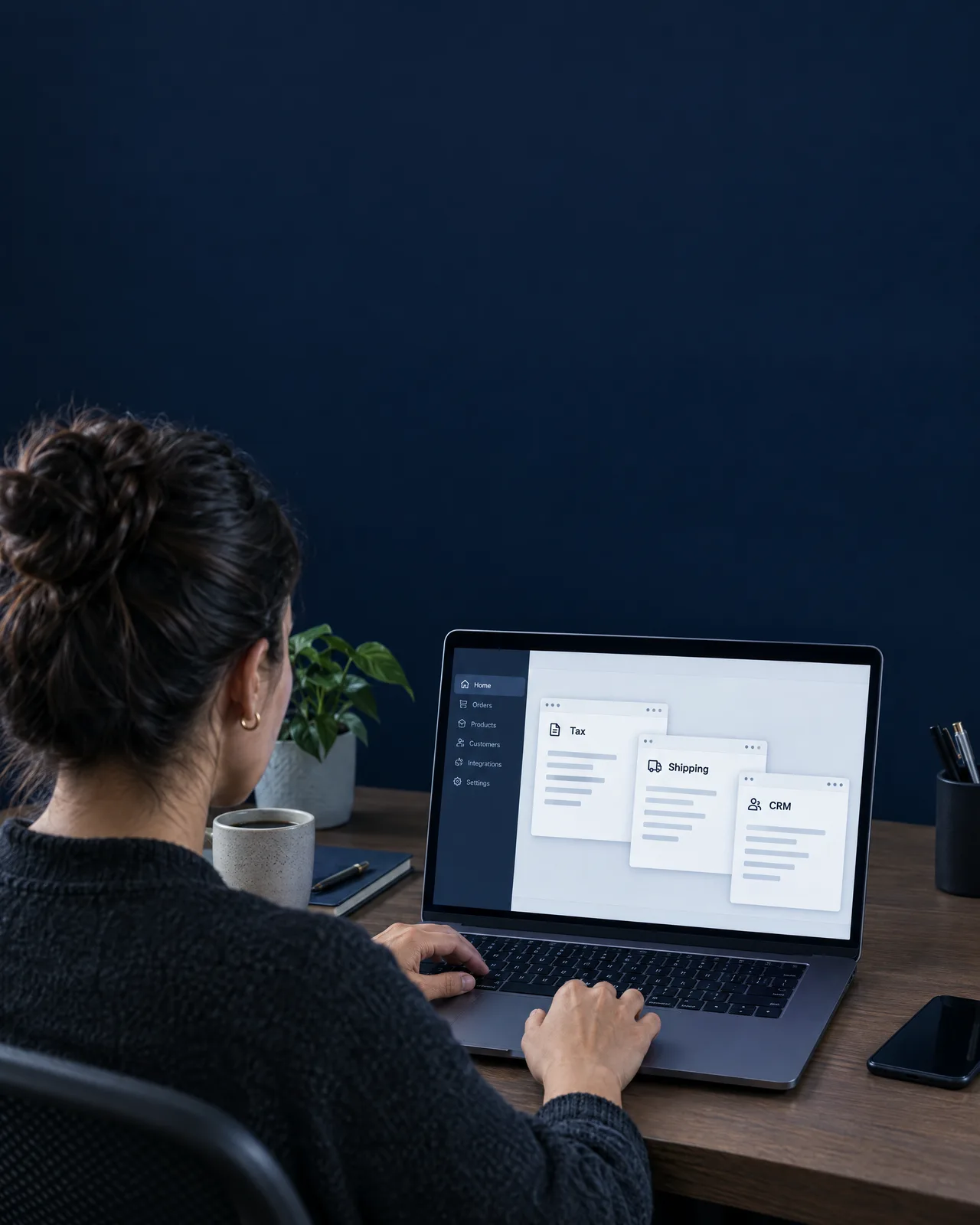 Buyer at a procurement desk with tax, shipping and CRM tools open in separate windows Buyer at a procurement desk with tax, shipping and CRM tools open in separate windows