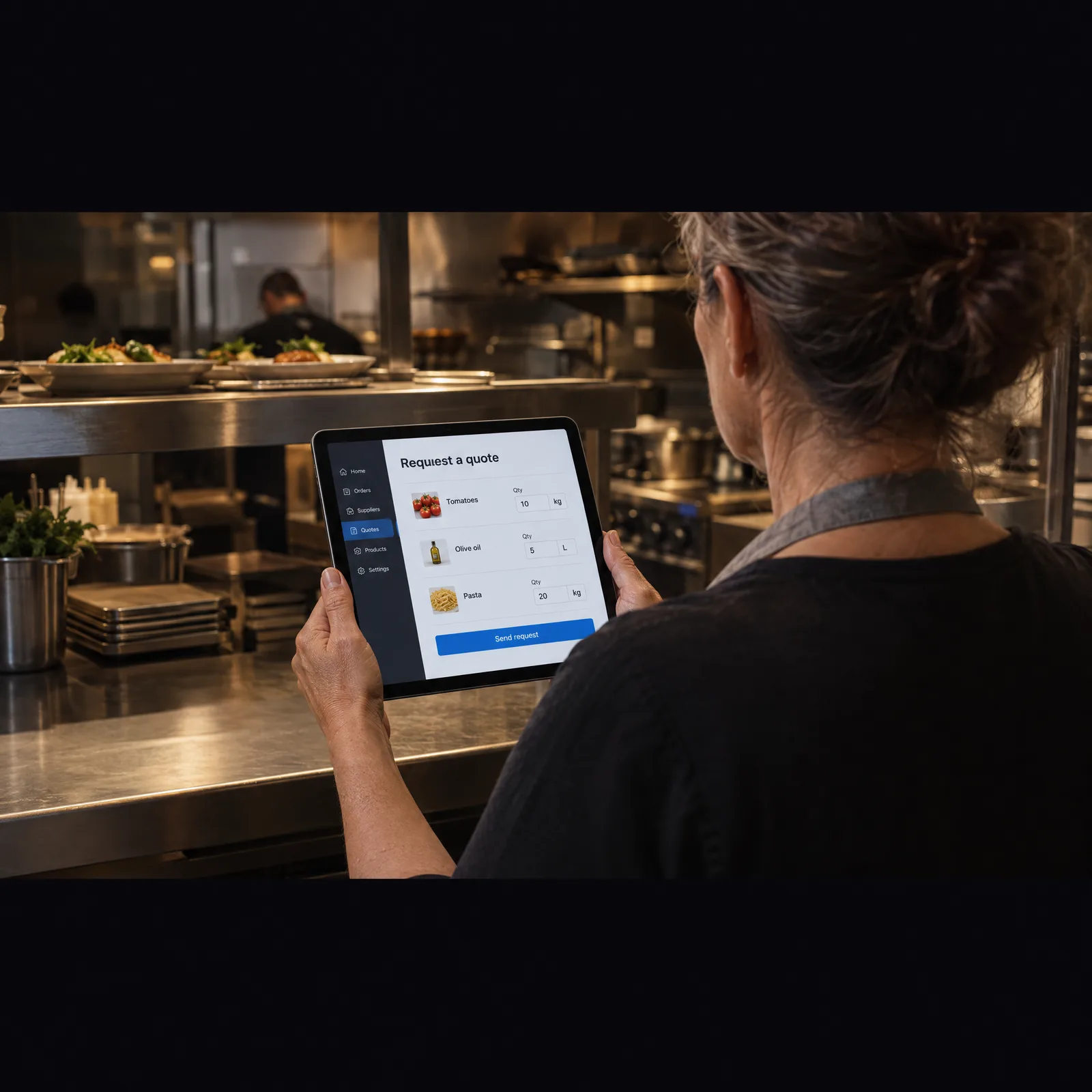 Restaurant owner requesting a quote for kitchen supplies on a tablet at the pass Restaurant owner requesting a quote for kitchen supplies on a tablet at the pass