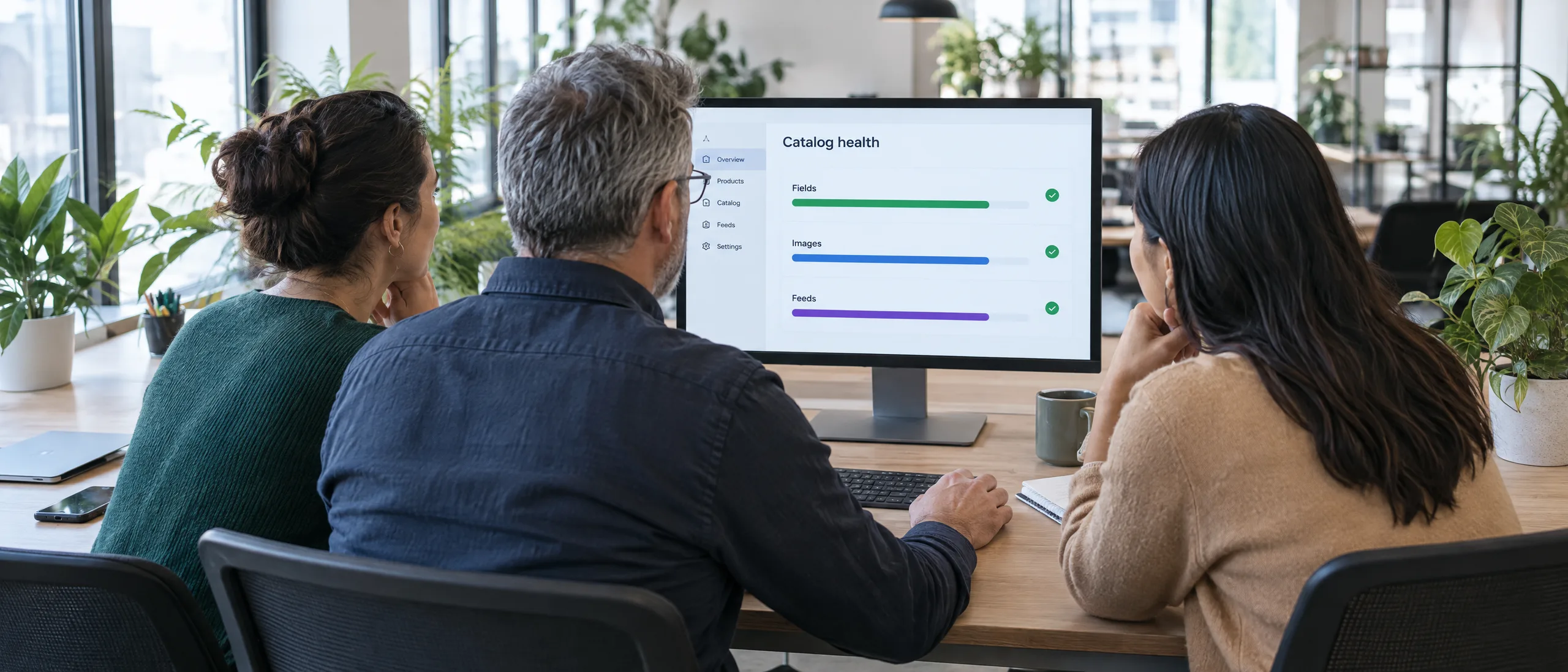 Developer, ERP engineer and marketer reviewing one product data report together Developer, ERP engineer and marketer reviewing one product data report together