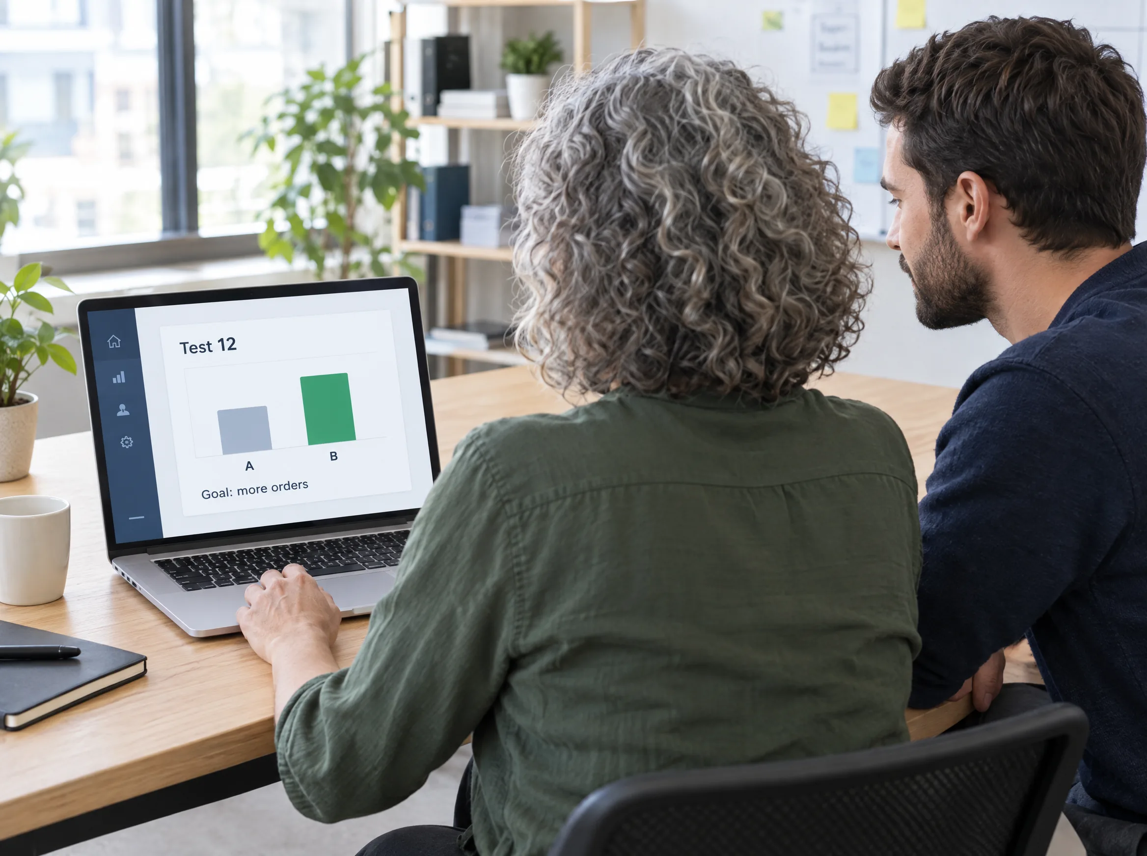 Marketer and developer reading a store test result with two versions on a laptop Marketer and developer reading a store test result with two versions on a laptop