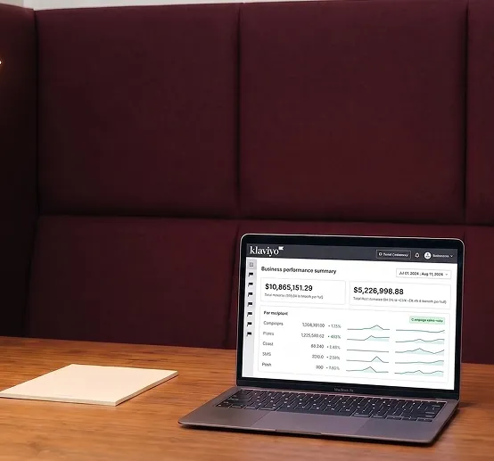 Enterprise ecommerce merchandiser preparing a Klaviyo campaign on a desktop while reviewing product catalog data on a second monitor Enterprise ecommerce merchandiser preparing a Klaviyo campaign on a desktop while reviewing product catalog data on a second monitor