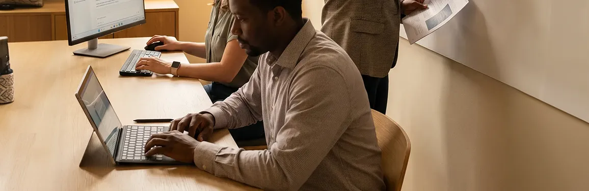 Senior AI consultant leading strategy session with enterprise team around a roadmap Senior AI consultant leading strategy session with enterprise team around a roadmap