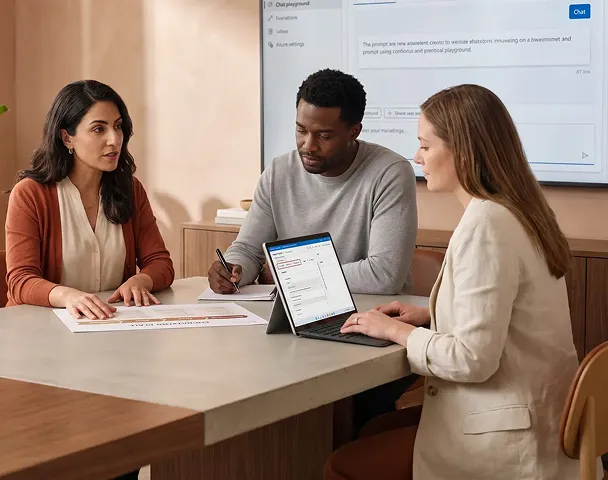 Small AI consulting team in focused intake strategy review around a conference table with a printed DISCOVER PILOT SCALE engagement plan and Azure AI Foundry Prompt Flow on a Surface laptop, natural light Small AI consulting team in focused intake strategy review around a conference table with a printed DISCOVER PILOT SCALE engagement plan and Azure AI Foundry Prompt Flow on a Surface laptop, natural light