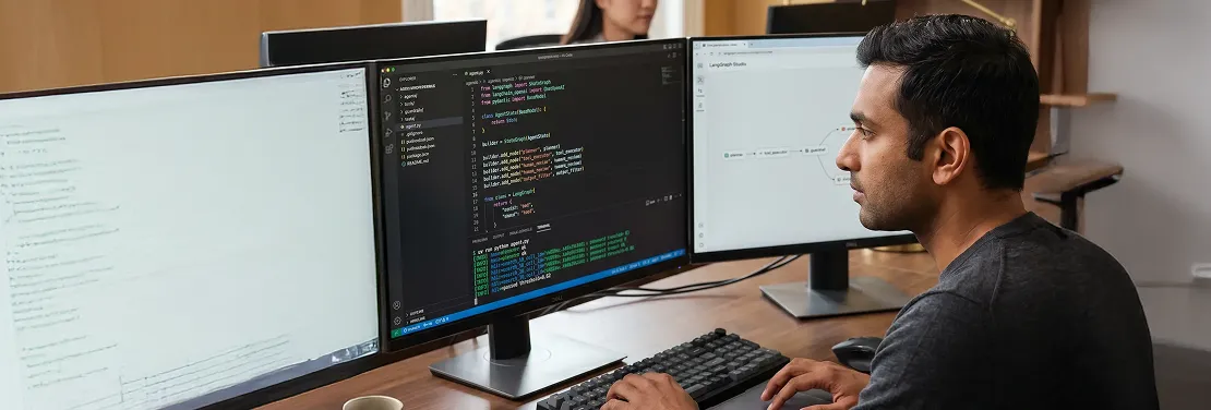 AI engineer reviewing autonomous agent workflow architecture on dual monitors AI engineer reviewing autonomous agent workflow architecture on dual monitors