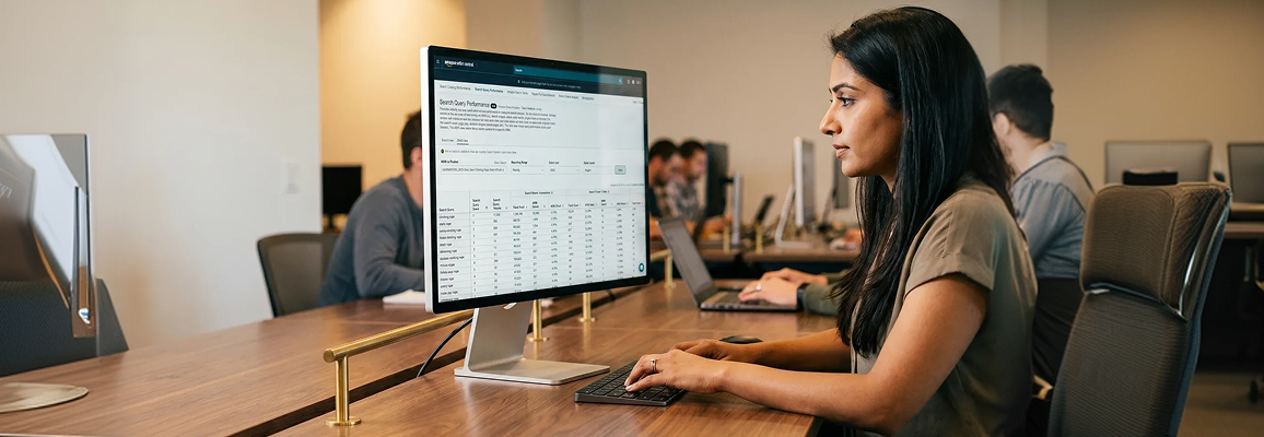 Amazon search engine optimization analyst reviewing keyword rank mapping data on screen with focused side profile in natural desk light Amazon search engine optimization analyst reviewing keyword rank mapping data on screen with focused side profile in natural desk light