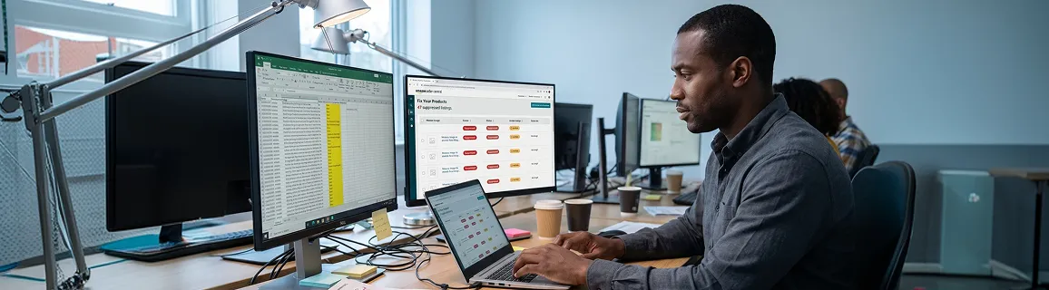 Ecommerce seller staring at multiple spreadsheet tabs showing inconsistent catalog data across screens, frustrated expression