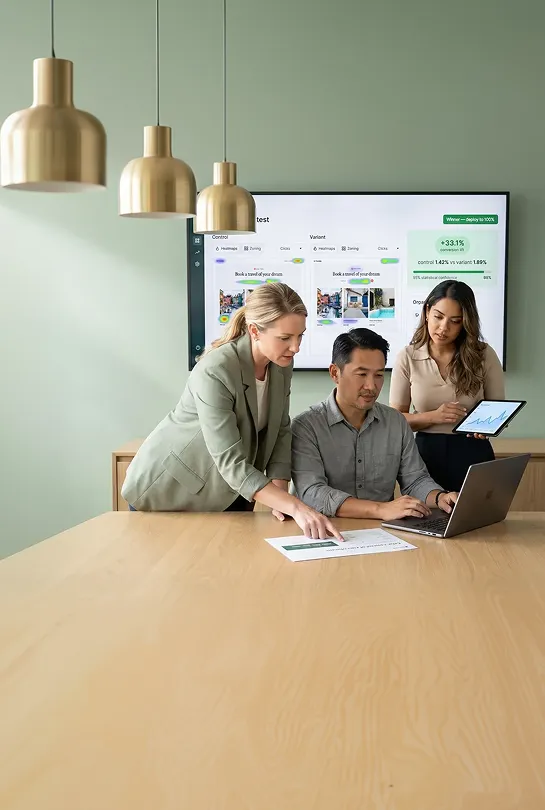 Ecommerce growth team collaborating over revenue lift results from a BigCommerce conversion rate optimization program