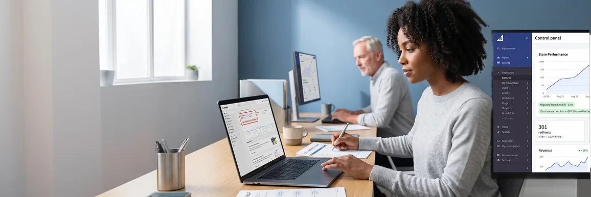 Merchant reviewing Shopify platform costs at laptop alongside BigCommerce control panel showing zero transaction fees Merchant reviewing Shopify platform costs at laptop alongside BigCommerce control panel showing zero transaction fees
