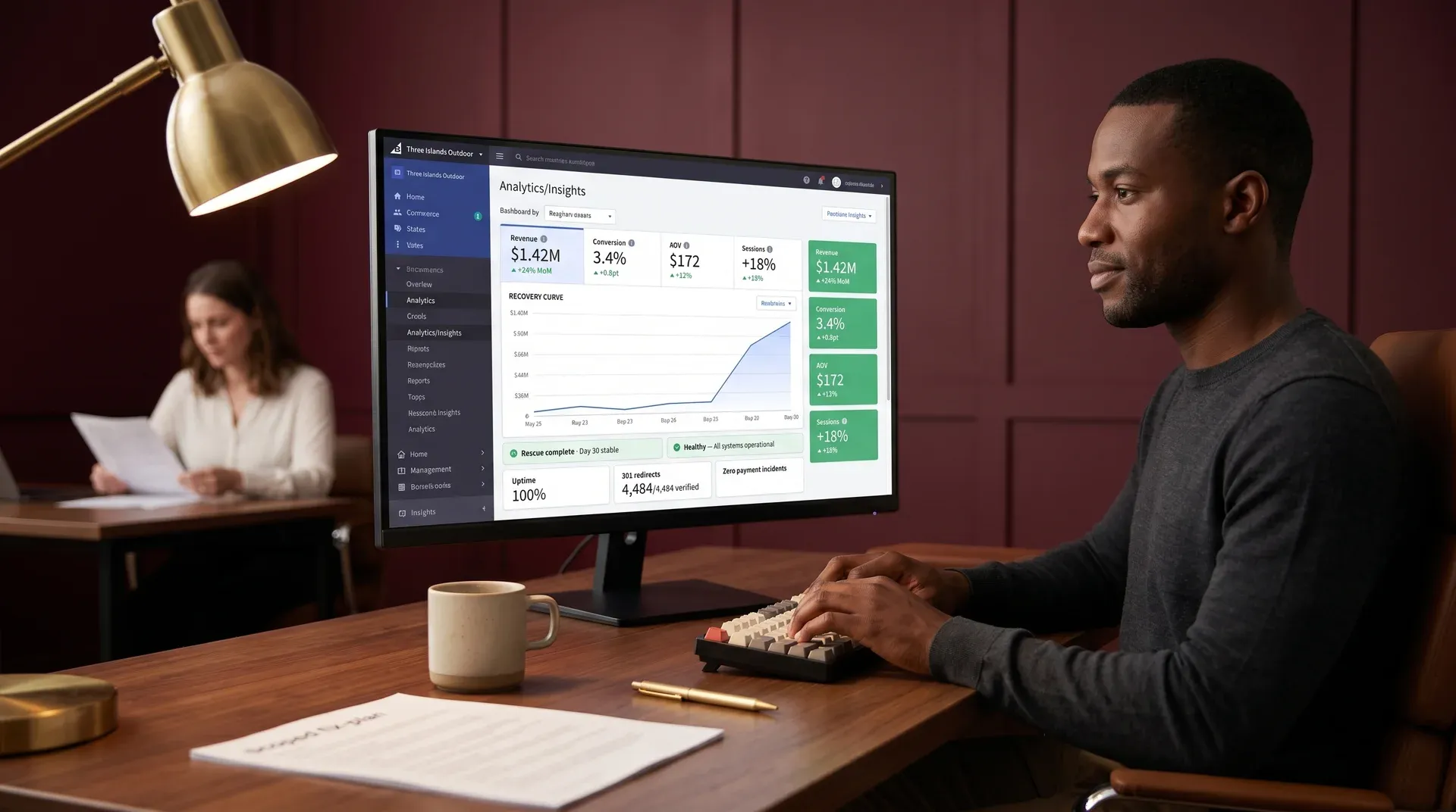 Developer reviewing BigCommerce analytics dashboard showing restored revenue recovery curve after store rescue by Redefine Developer reviewing BigCommerce analytics dashboard showing restored revenue recovery curve after store rescue by Redefine
