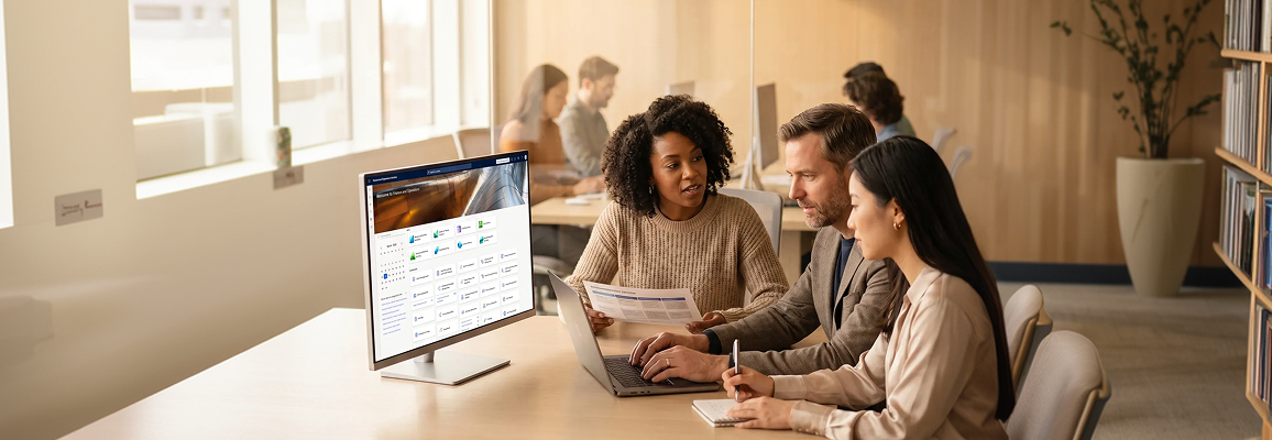 Consulting team reviewing enterprise resource planning implementation strategy in a modern office environment Consulting team reviewing enterprise resource planning implementation strategy in a modern office environment