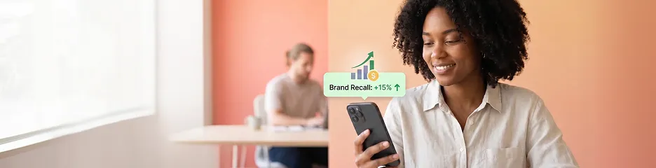 Marketing manager reviewing a cohesive on-brand social media feed on a phone at a desk with natural window light, calm and confident Marketing manager reviewing a cohesive on-brand social media feed on a phone at a desk with natural window light, calm and confident