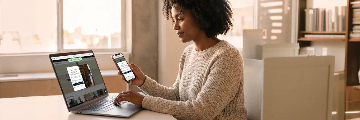 Marketing manager calmly reviewing the freshly launched responsive mobile website on a smartphone, satisfied with the result Marketing manager calmly reviewing the freshly launched responsive mobile website on a smartphone, satisfied with the result