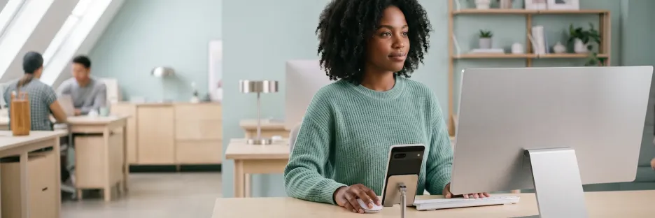 Person frustrated with a poorly designed Android app showing confusing navigation on a phone at a desk with natural office light Person frustrated with a poorly designed Android app showing confusing navigation on a phone at a desk with natural office light