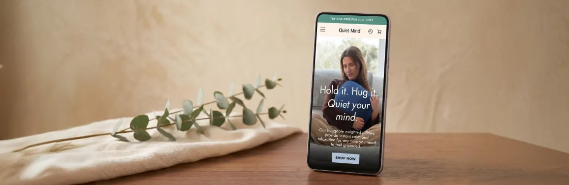 One Quiet Mind wellness brand mobile user interface design displayed on an Android phone with clean natural light showing Material Design-informed interface One Quiet Mind wellness brand mobile user interface design displayed on an Android phone with clean natural light showing Material Design-informed interface