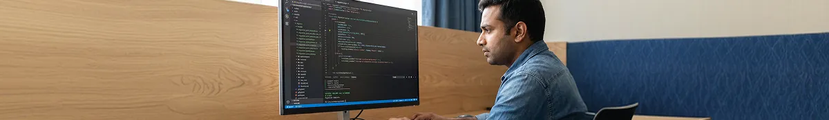 Developer reviewing data-migration validation output in VS Code with a green successful migration run in the terminal Developer reviewing data-migration validation output in VS Code with a green successful migration run in the terminal