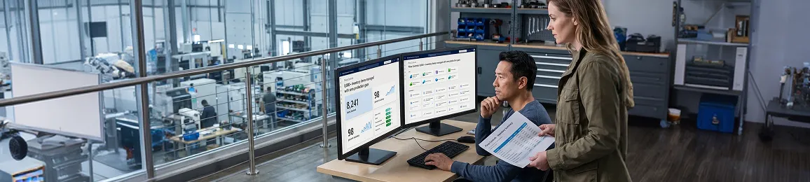 Industrial operations team reviewing unified enterprise resource planning and customer relationship management integration results on multiple monitors Industrial operations team reviewing unified enterprise resource planning and customer relationship management integration results on multiple monitors