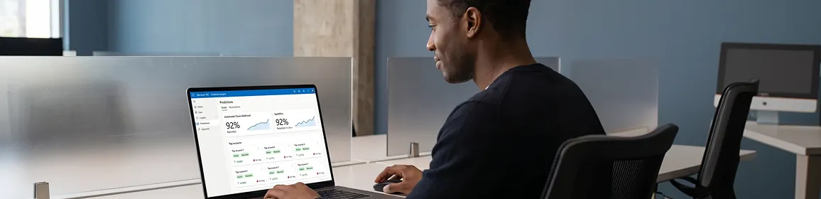 Account manager reviewing automated Dynamics 365 Customer Insights churn scoring that replaced the manual Monday spreadsheet review Account manager reviewing automated Dynamics 365 Customer Insights churn scoring that replaced the manual Monday spreadsheet review