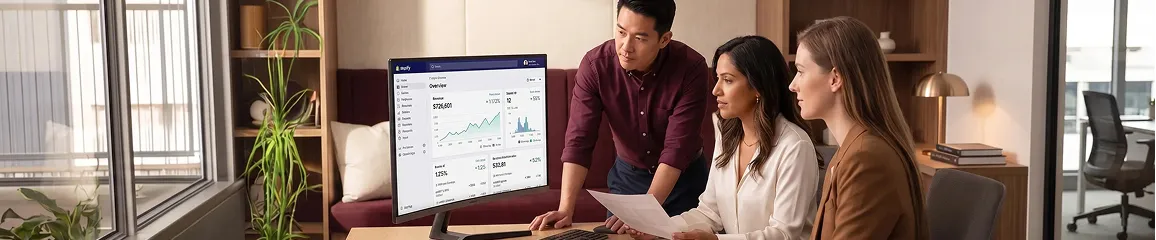 Half Price Drapes ecommerce operations team reviewing unified Shopify and ERP analytics dashboard following integration go-live Half Price Drapes ecommerce operations team reviewing unified Shopify and ERP analytics dashboard following integration go-live
