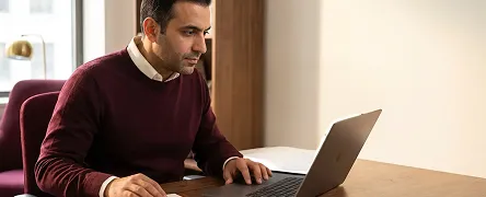 Ecommerce strategist reviewing BigCommerce integration metrics and analytics on laptop Ecommerce strategist reviewing BigCommerce integration metrics and analytics on laptop