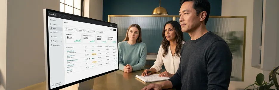 Enterprise ecommerce operations team reviewing Klaviyo email performance analytics on a large monitor Enterprise ecommerce operations team reviewing Klaviyo email performance analytics on a large monitor
