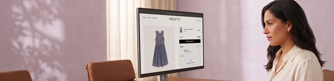 Luxury fashion brand founder reviewing payment conversion dashboards in morning office environment Luxury fashion brand founder reviewing payment conversion dashboards in morning office environment