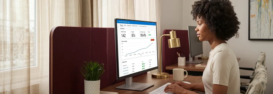 Ecommerce operations lead reviewing live Rakuten order dashboard at desk, natural side light Ecommerce operations lead reviewing live Rakuten order dashboard at desk, natural side light