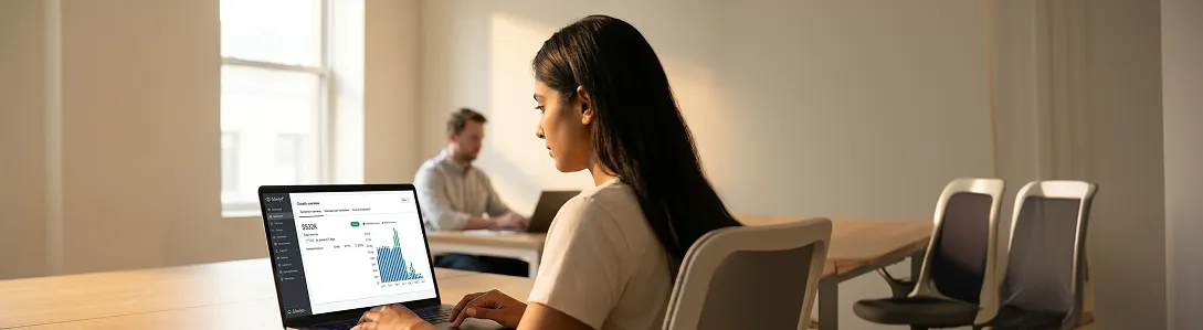 Email marketing analyst reviewing Klaviyo retention dashboard, natural office light Email marketing analyst reviewing Klaviyo retention dashboard, natural office light