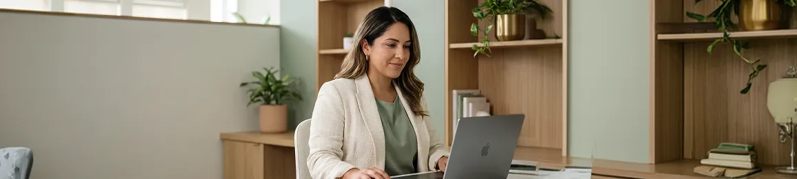 Merchant at laptop dealing with fragmented email tools and failed deliverability before Klaviyo setup Merchant at laptop dealing with fragmented email tools and failed deliverability before Klaviyo setup
