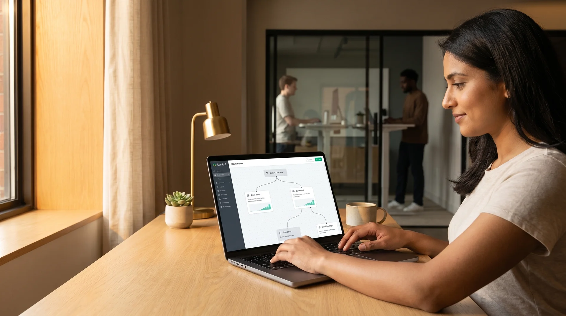 Founder reviewing email automation flows on laptop before completing activecampaign to klaviyo migration, warm office light, side angle Founder reviewing email automation flows on laptop before completing activecampaign to klaviyo migration, warm office light, side angle