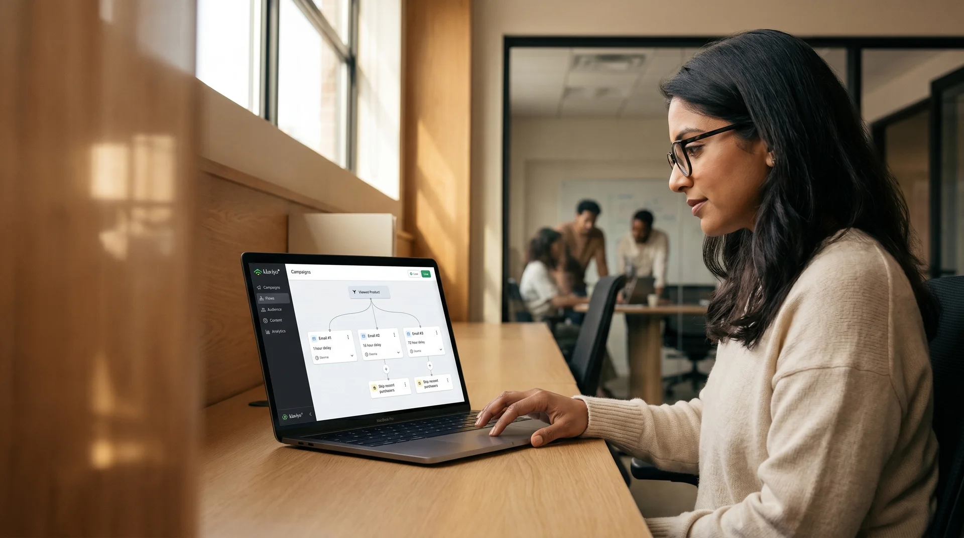 Lifecycle manager reviewing a Klaviyo browse abandonment email flow on a laptop in a bright office setting Lifecycle manager reviewing a Klaviyo browse abandonment email flow on a laptop in a bright office setting
