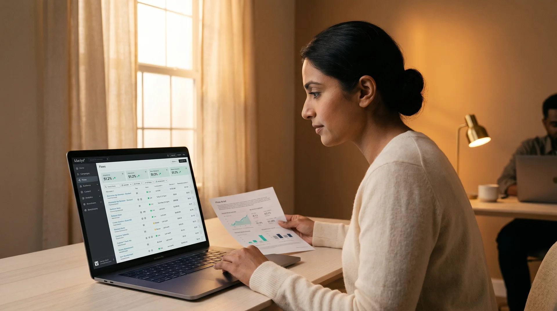 CRM retention lead reviewing email automation platform at laptop, warm office light, side angle CRM retention lead reviewing email automation platform at laptop, warm office light, side angle