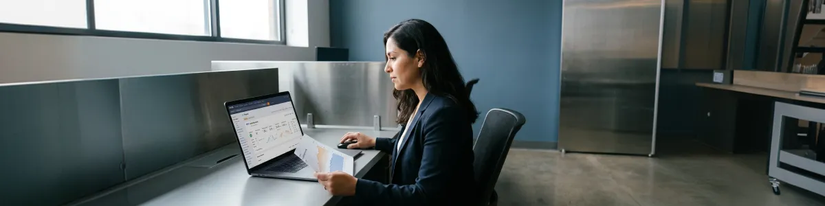 Content manager reviewing stalled search engine optimization ranking reports across multiple screens, concentrated frustration, warm desk lighting Content manager reviewing stalled search engine optimization ranking reports across multiple screens, concentrated frustration, warm desk lighting