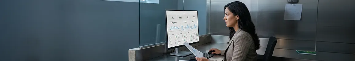 Ecommerce marketing director calmly reviewing climbing organic search performance dashboard on monitor, cool office light Ecommerce marketing director calmly reviewing climbing organic search performance dashboard on monitor, cool office light
