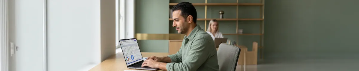 Social media strategist reviewing content calendar and engagement analytics with calm confident expression, natural morning window light Social media strategist reviewing content calendar and engagement analytics with calm confident expression, natural morning window light