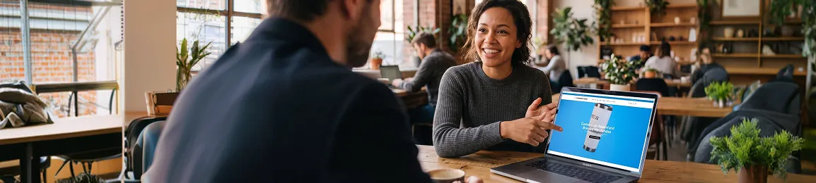Corporate ecommerce operations team reviewing revenue milestone driven by conversion rate optimization and user experience improvements Corporate ecommerce operations team reviewing revenue milestone driven by conversion rate optimization and user experience improvements