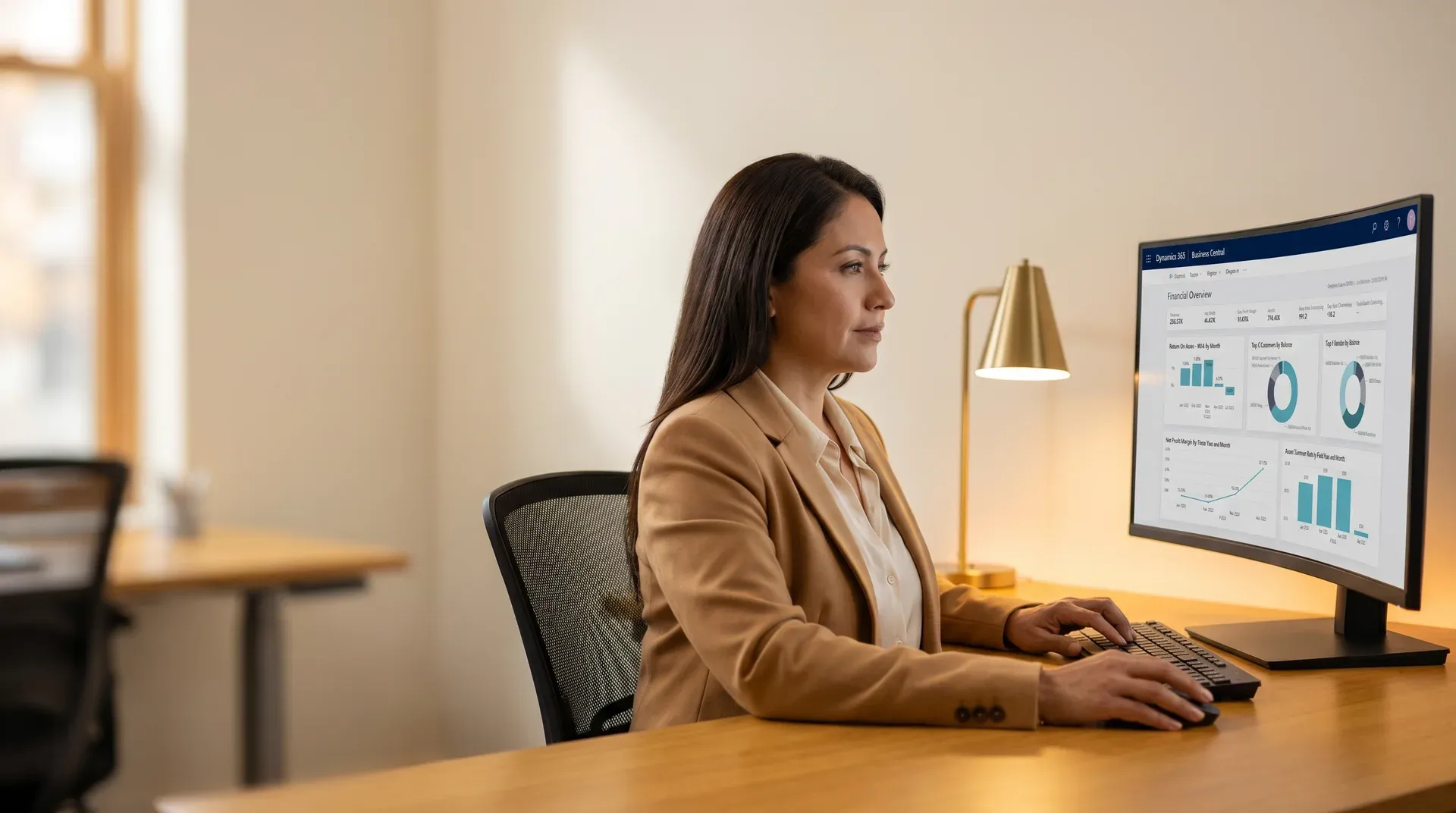 Finance leader reviewing Business Central profit and loss report inside a Power BI report on a widescreen monitor Finance leader reviewing Business Central profit and loss report inside a Power BI report on a widescreen monitor