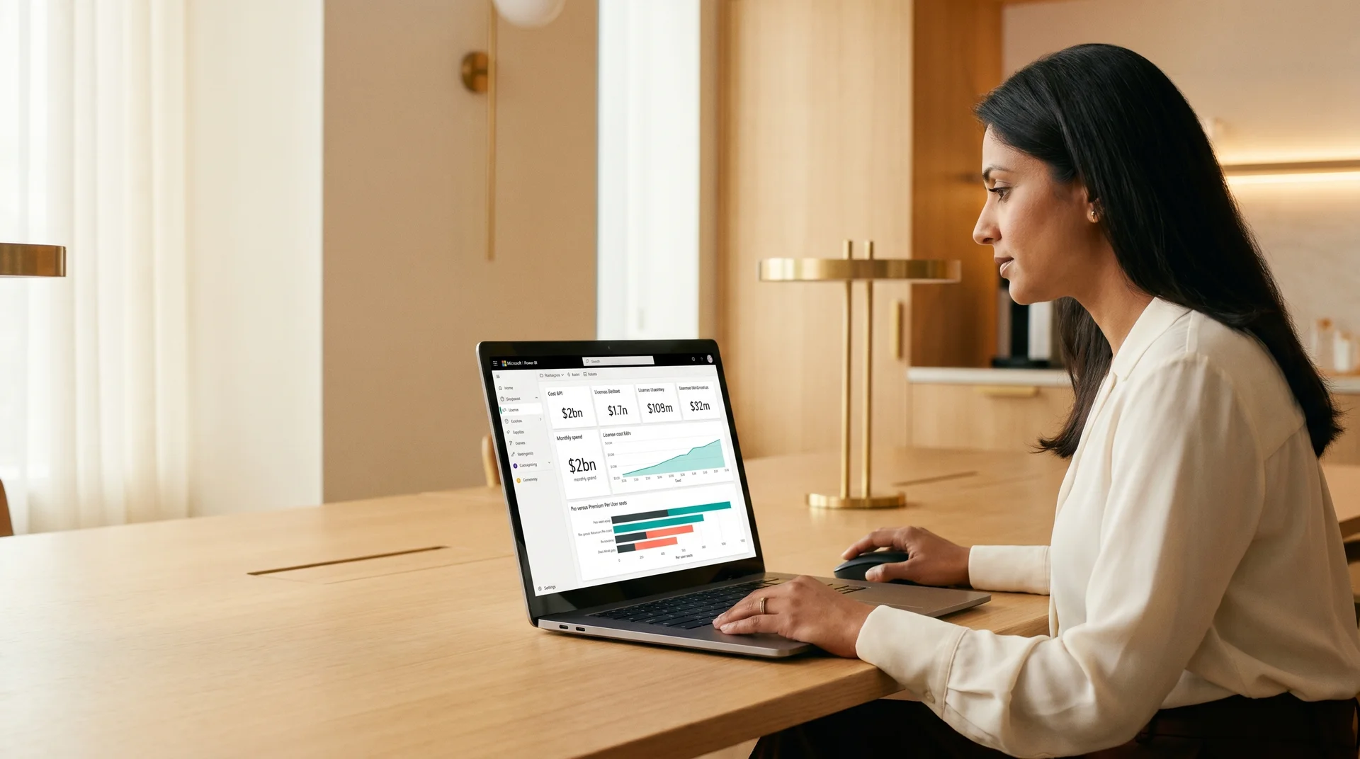 Finance and operations lead reviewing Power BI licensing advisory cost breakdown on a laptop Finance and operations lead reviewing Power BI licensing advisory cost breakdown on a laptop
