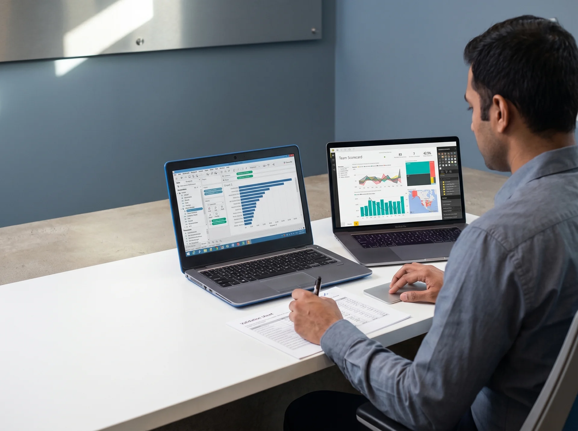 Analyst reviewing two laptops side-by-side showing a Tableau workbook next to its Power BI equivalent Analyst reviewing two laptops side-by-side showing a Tableau workbook next to its Power BI equivalent
