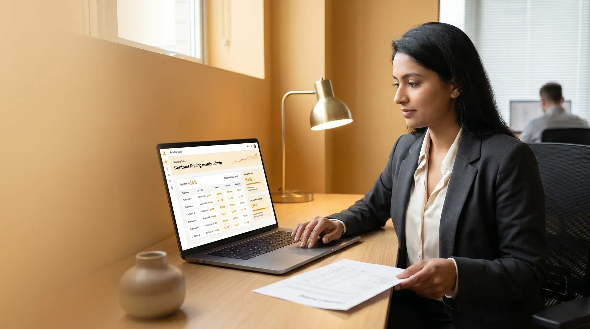 Account manager reviewing customer-specific pricing agreements in a professional office setting Account manager reviewing customer-specific pricing agreements in a professional office setting