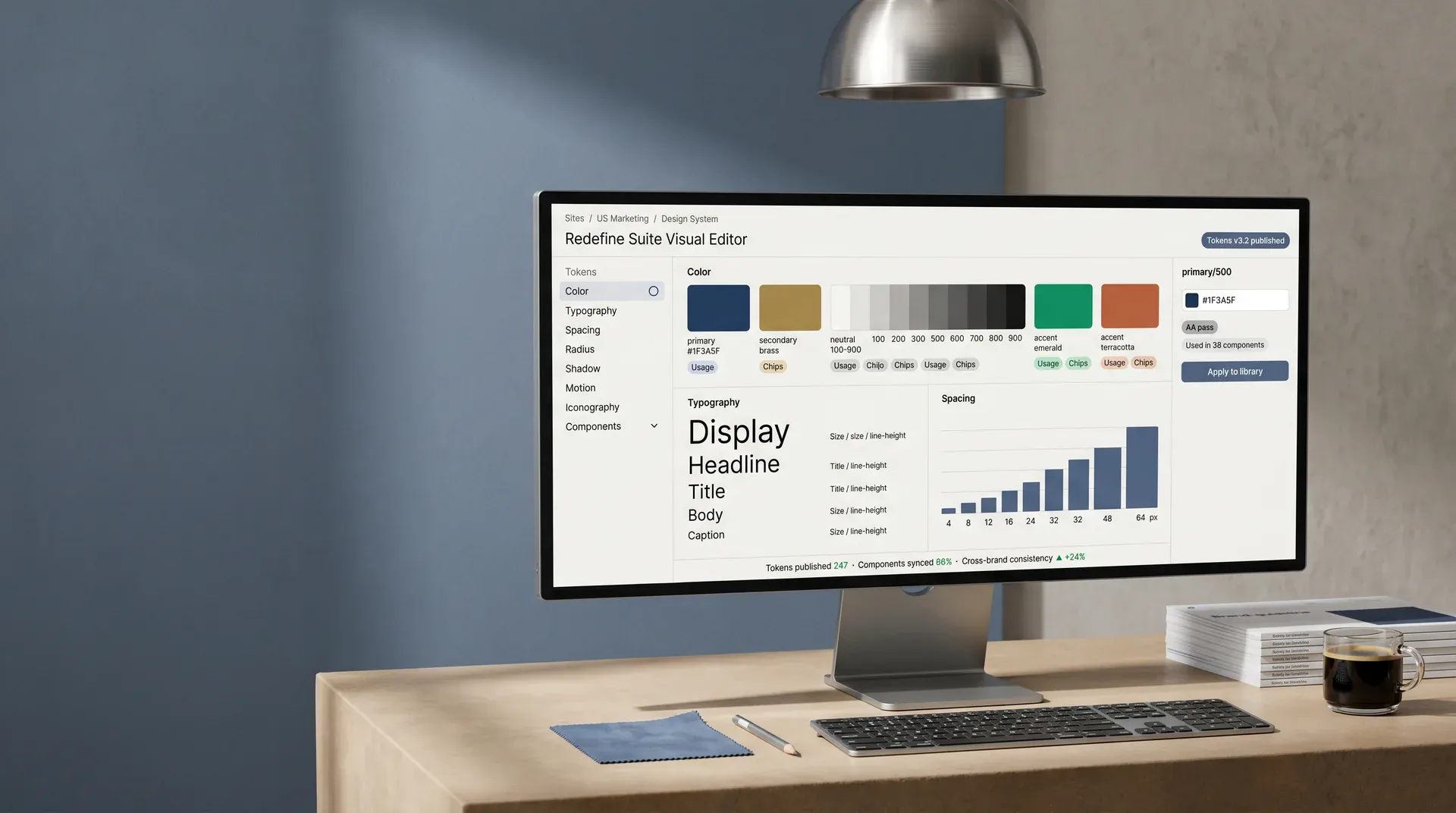 Design system token library on an ultrawide monitor showing color swatches, typography stack, and spacing scale Design system token library on an ultrawide monitor showing color swatches, typography stack, and spacing scale