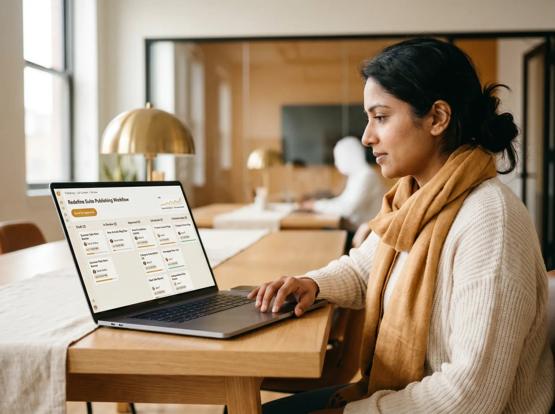 Content team member reviewing draft and approval states on a publishing workflow dashboard, natural light office Content team member reviewing draft and approval states on a publishing workflow dashboard, natural light office
