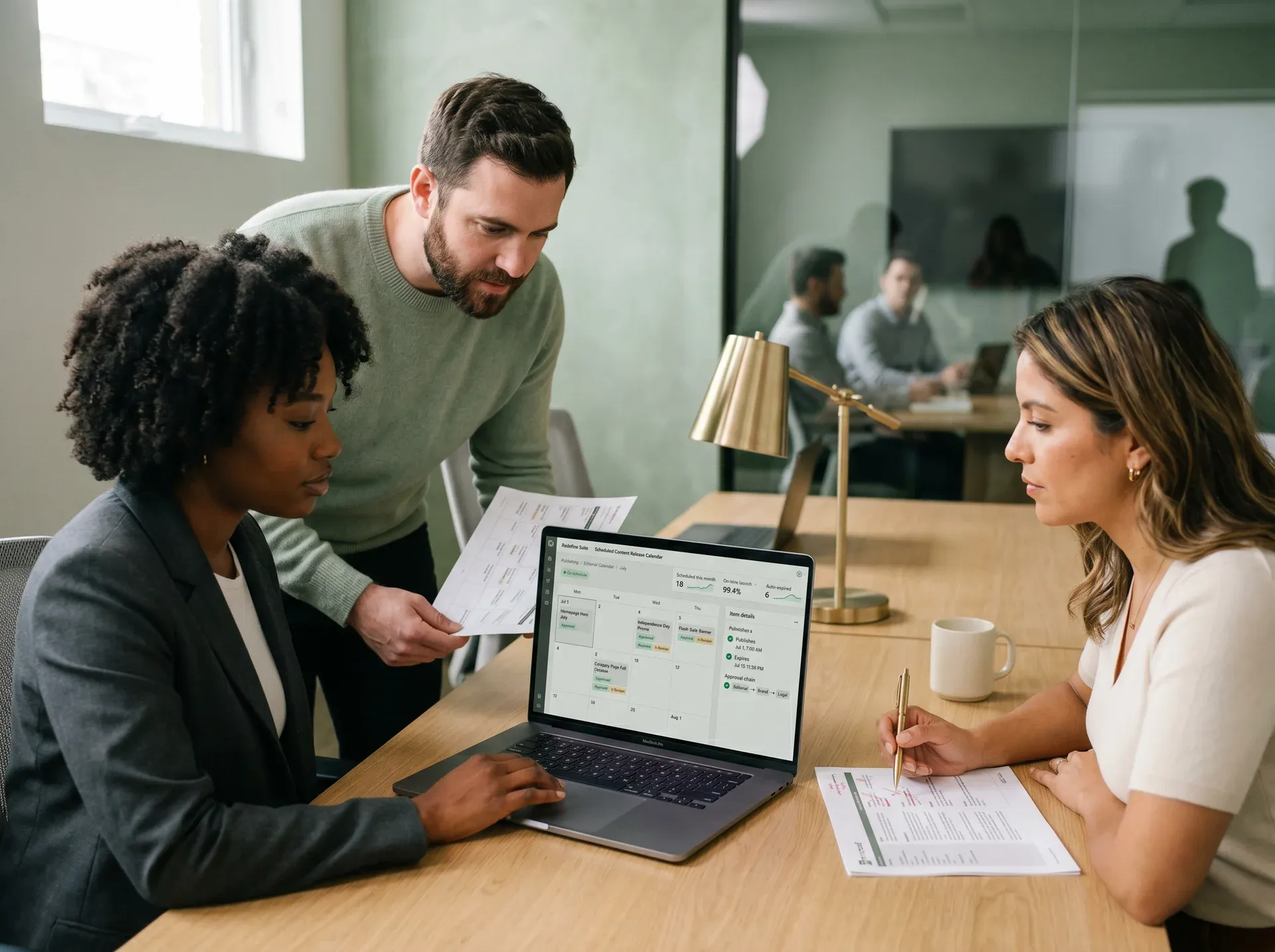 Marketing and editorial team collaborating on a scheduled content release calendar, reviewing approval states together Marketing and editorial team collaborating on a scheduled content release calendar, reviewing approval states together
