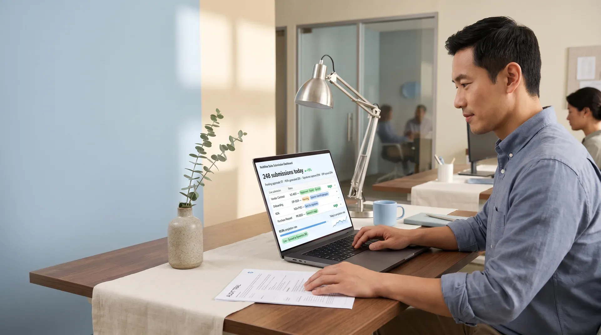 Operations lead checking a document submission dashboard on an office workstation Operations lead checking a document submission dashboard on an office workstation