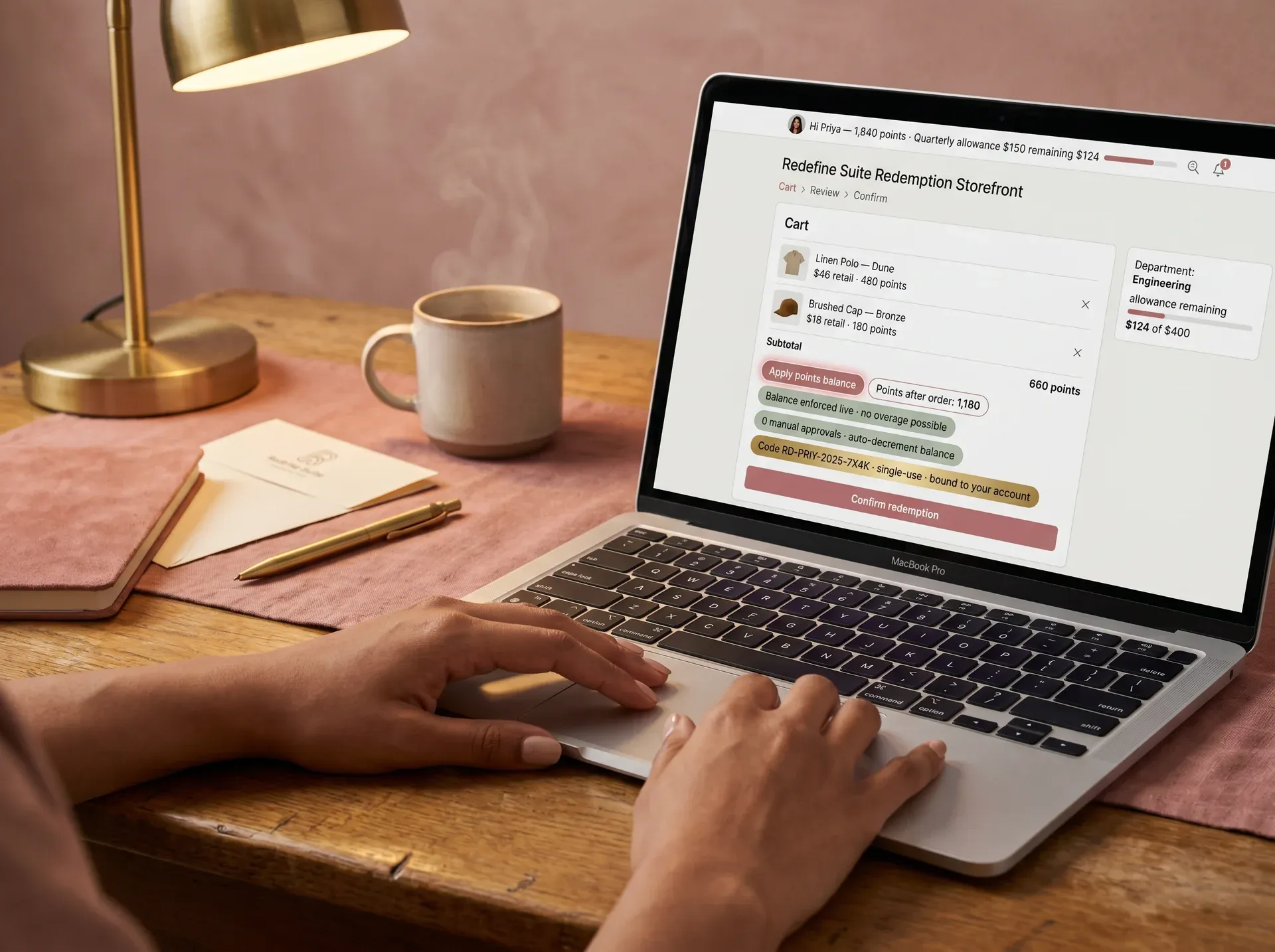Employee applying points balance from rewards portal to company store checkout on laptop