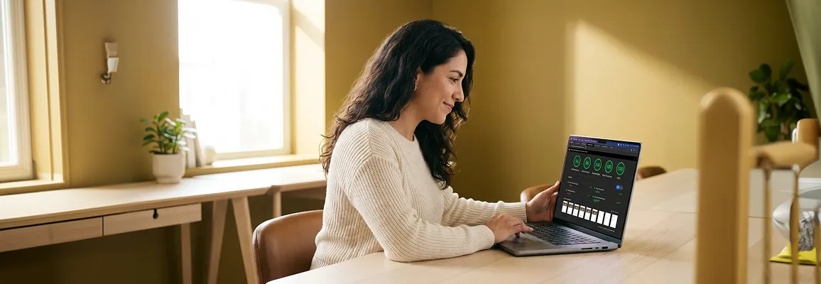 Ecommerce founder reviewing store performance at a laptop in a modern workspace Ecommerce founder reviewing store performance at a laptop in a modern workspace