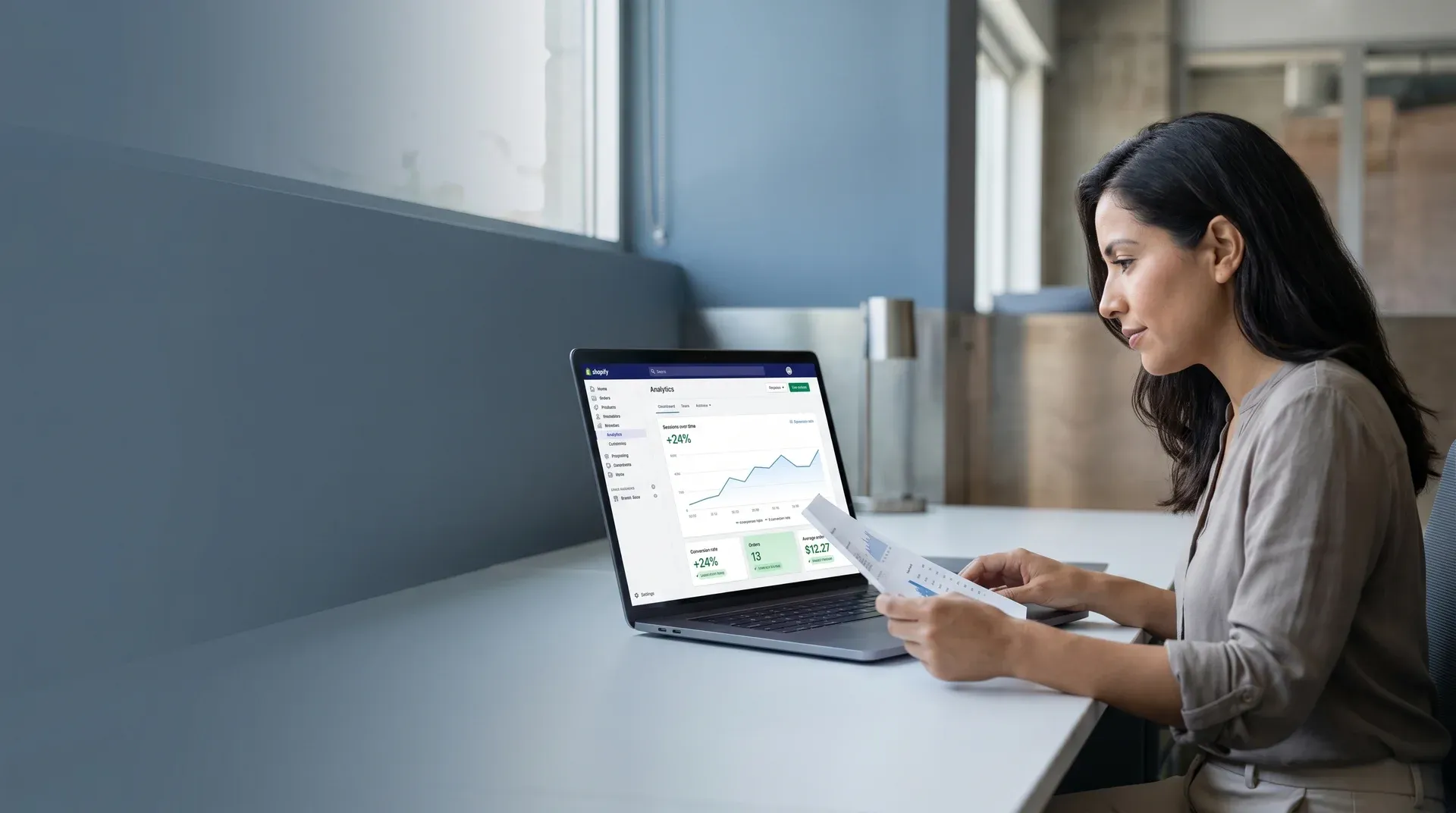 Marketing lead studying landing page performance data at their desk Marketing lead studying landing page performance data at their desk