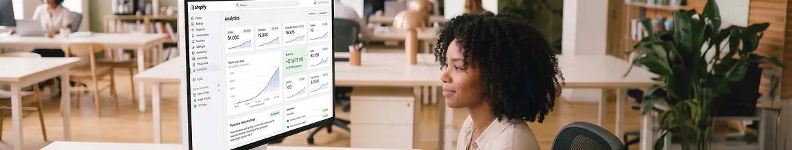 B2B ecommerce team reviewing headless platform rebuild performance improvements on analytics screen B2B ecommerce team reviewing headless platform rebuild performance improvements on analytics screen