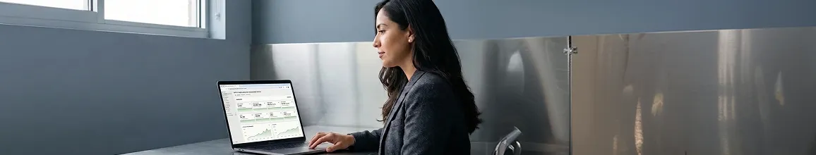 Ecommerce operations manager calmly reviewing one unified Shopify retainer dashboard with steady upward growth Ecommerce operations manager calmly reviewing one unified Shopify retainer dashboard with steady upward growth