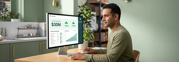 B2B operations director reviewing Sleekshop centralized order management and wholesale channel performance on screen in modern distribution center B2B operations director reviewing Sleekshop centralized order management and wholesale channel performance on screen in modern distribution center