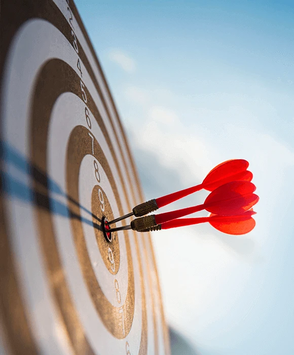 Three darts hitting the bullseye on a dartboard, representing precision and focus on mission Three darts hitting the bullseye on a dartboard, representing precision and focus on mission